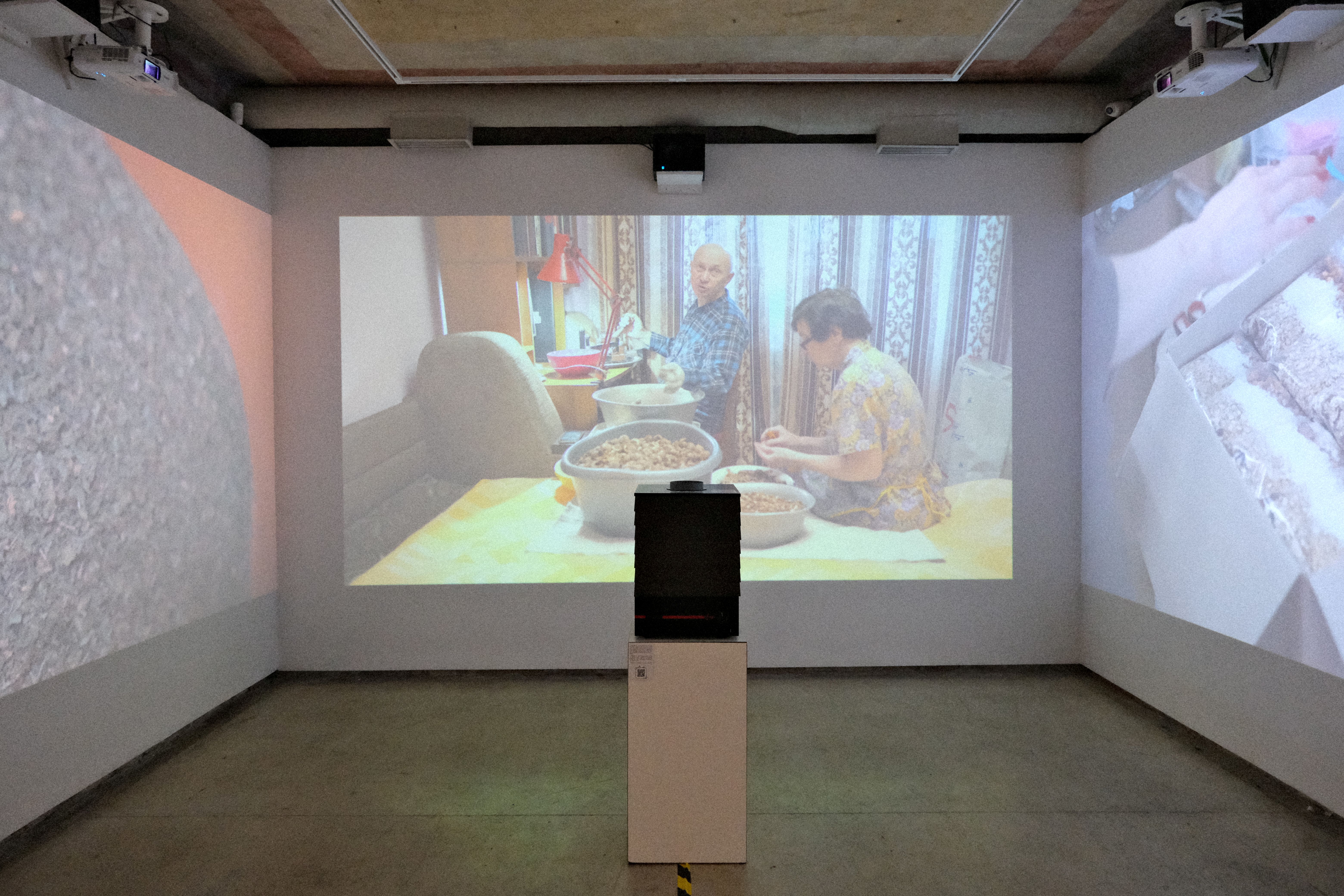 The projector is showing scenes from the movie