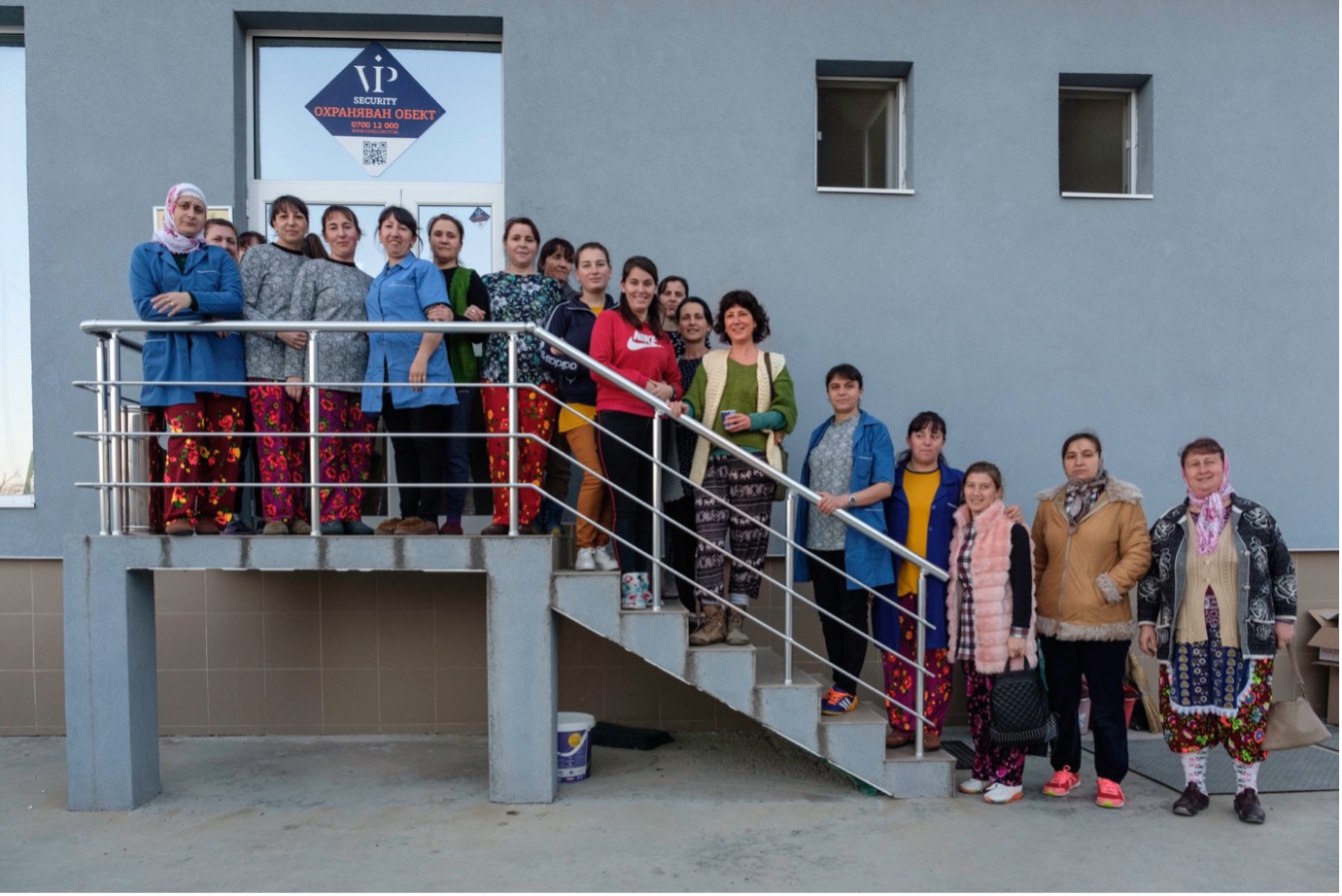 Kapka Kassabova with factory owner Rabié Yumer (behind author) and her staff. Photograph by Anthony Georgieff