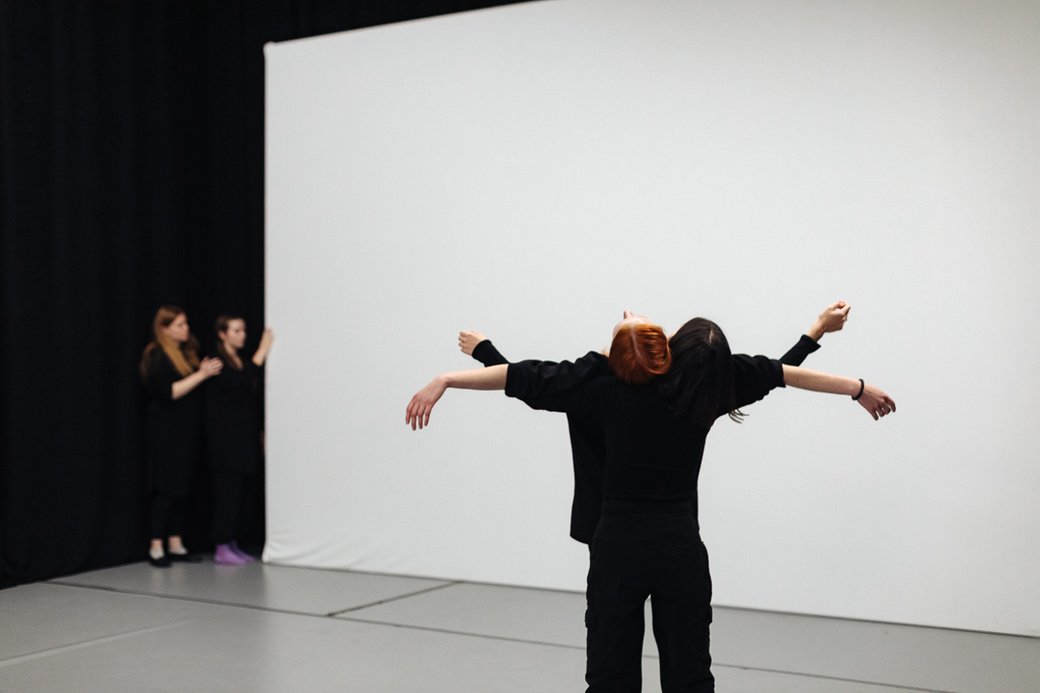 People in black clothes are dancing