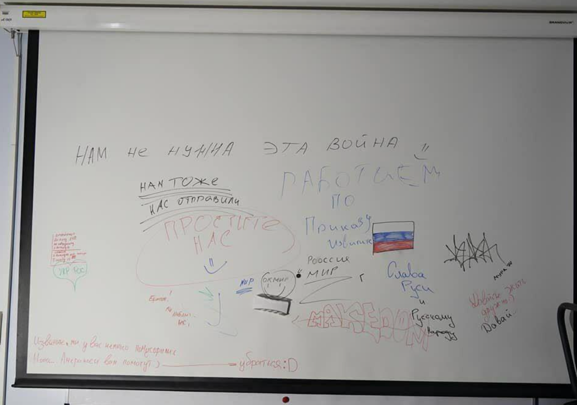 Inscriptions on the white board made by Russian occupiers in Ukraine