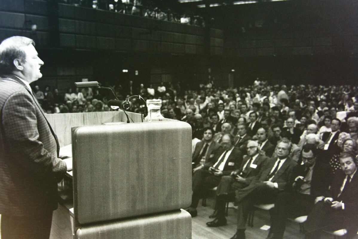 Lech Walesa stands in front of the hall of guests to give a keynote speech