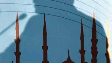 Der Schatten des türkischen Staatspräsidenten Recep Tayyip Erdoğan fällt auf das Bild einer Moschee während seiner Rede vor der türkischen Religionsbehörde in Ankara, 3. August 2016