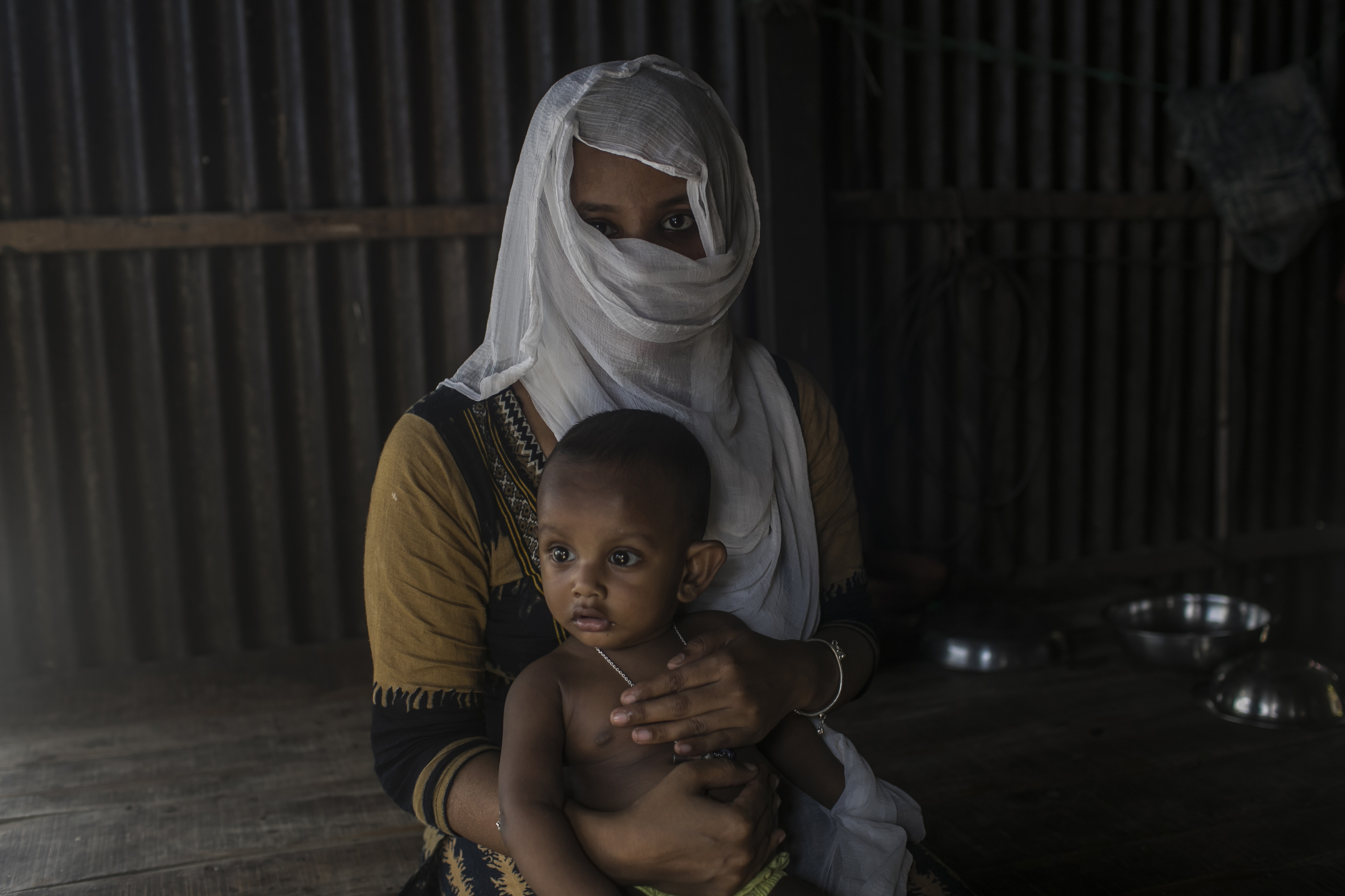 A sex worker holding her baby in a brothel in Daulatdia, Bangladesh, August 7, 2021.  