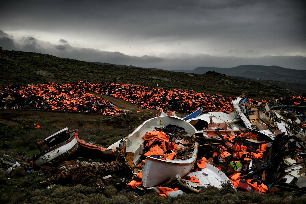 Wrecked boats and thousands of life jackets used by refugees and migrants during their journey across the Aegean sea lie in a dump in Mithimna, Lesbos