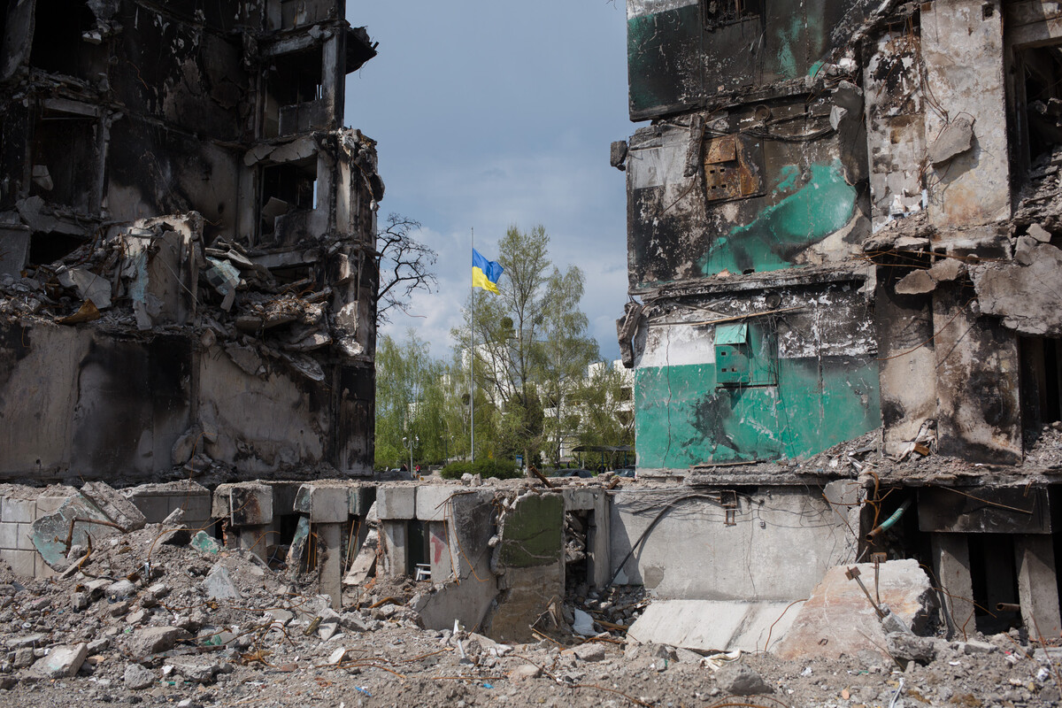  A view of the destroyed residential building with a Ukrainian flag in the background on May 3, 2022, in Borodyanka, Ukraine.