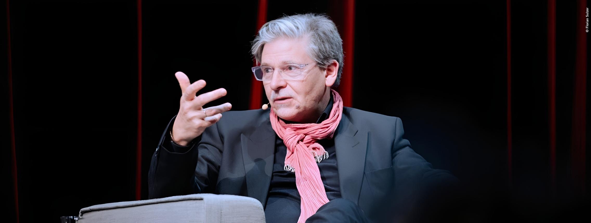 Jan-Werner Müller at a podium