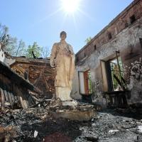 Statue of Hryhorii Skovoroda at the Skovoroda Museum in Kharkiv region after a Russian shell hit the building. Serhii Kozlov, May 2022.