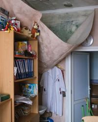 A bookcase in a bunker. by Roma Pashkovskiy
