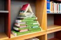 Green christmas tree built from books in the IWM library 