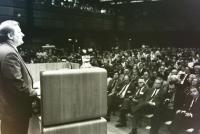 Lech Walesa stands in front of the hall of guests to give a keynote speech